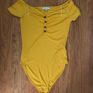 Yellow, off the shoulder leotard